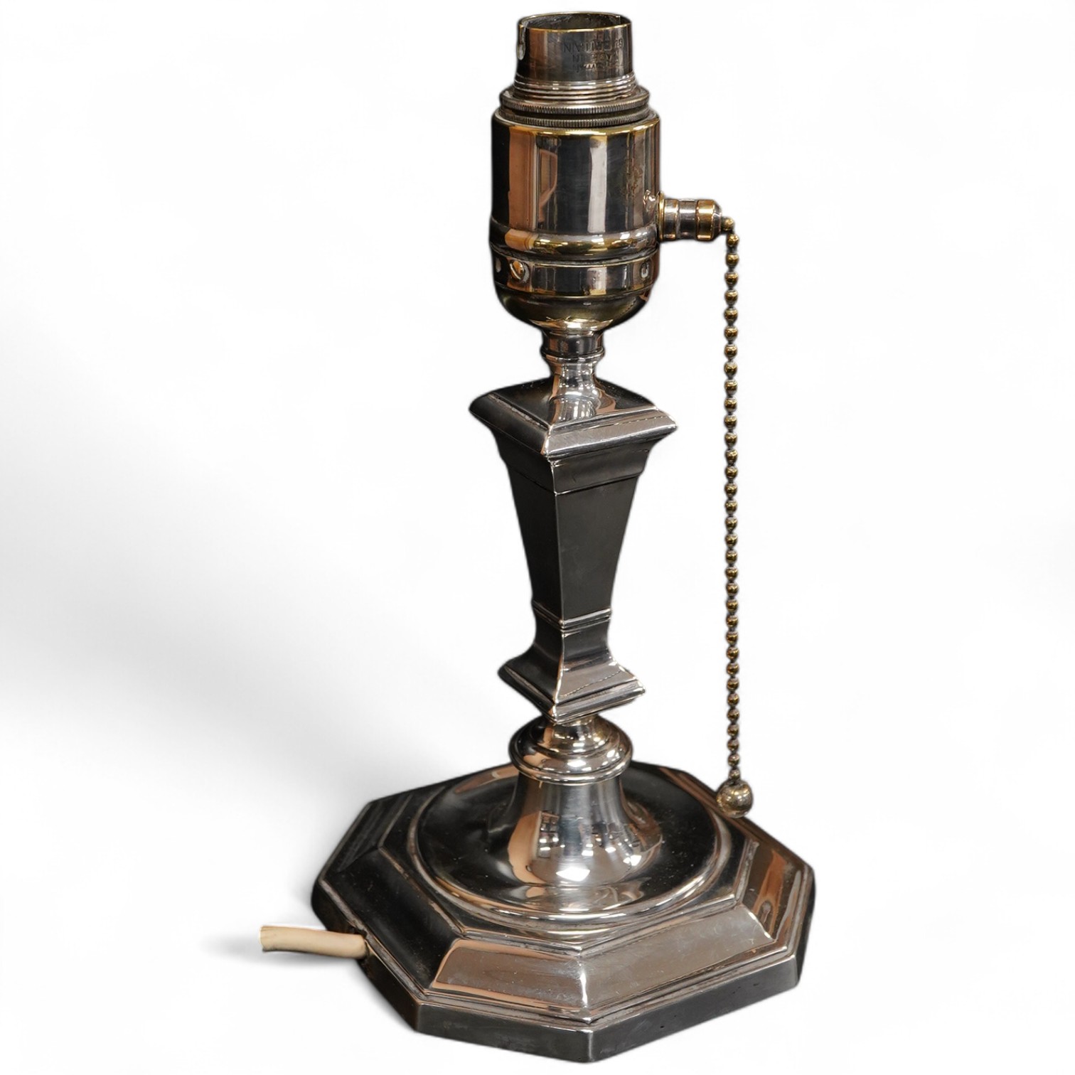 A George V silver mounted octagonal electric lamp base, with plate mounted brass top section, Mappin & Webb, London, 1929, height 22.5cm, weighted.